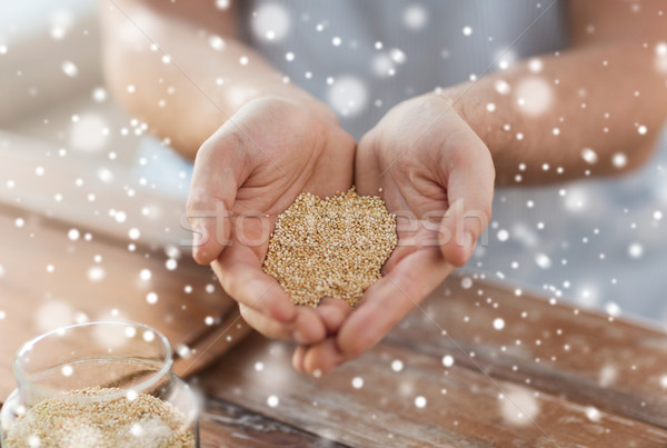 close up of male cupped hands with quinoa Stock photo © dolgachov