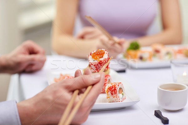 [[stock_photo]]: Couple · manger · sushis · restaurant · nourriture · de · restaurant