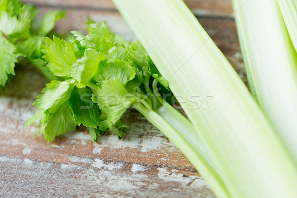 close up of celery stems on wooden table Stock photo © dolgachov