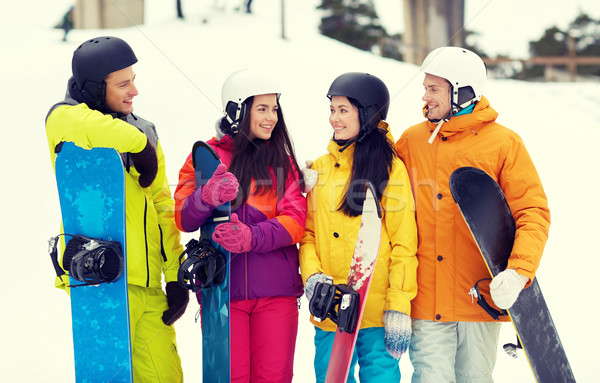 happy friends in helmets with snowboards talking Stock photo © dolgachov