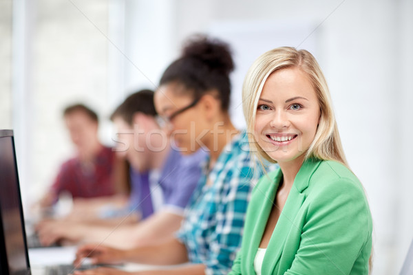 happy high school students in computer class Stock photo © dolgachov