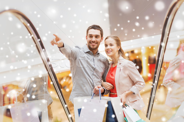 Stock foto: Paar · Einkaufstaschen · Rolltreppe · Mall · Verkauf · Konsumismus