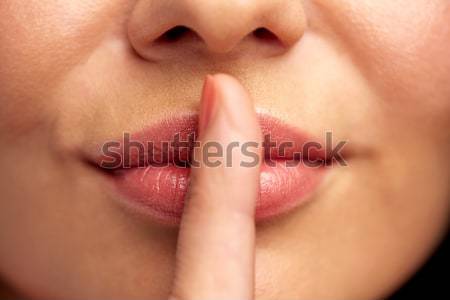 Jonge vrouw vinger lippen stilte Stockfoto © dolgachov