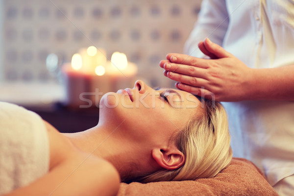 close up of woman having face massage in spa Stock photo © dolgachov