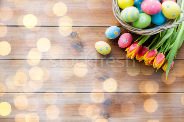 Közelkép húsvéti tojások kosár virágok húsvét ünnepek Stock fotó © dolgachov