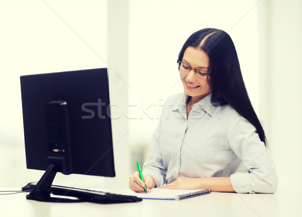 smiling businesswoman or student with eyeglasses Stock photo © dolgachov