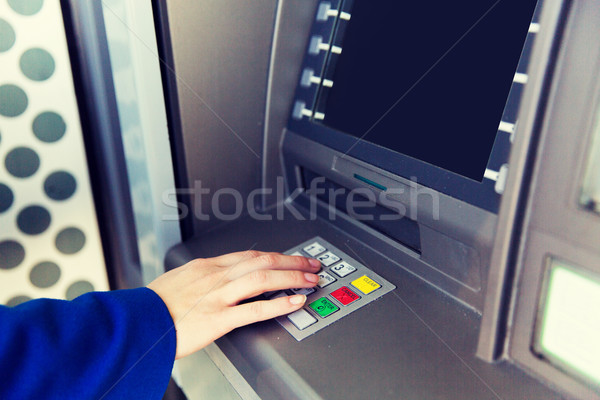 close up of hand entering pin code at cash machine Stock photo © dolgachov