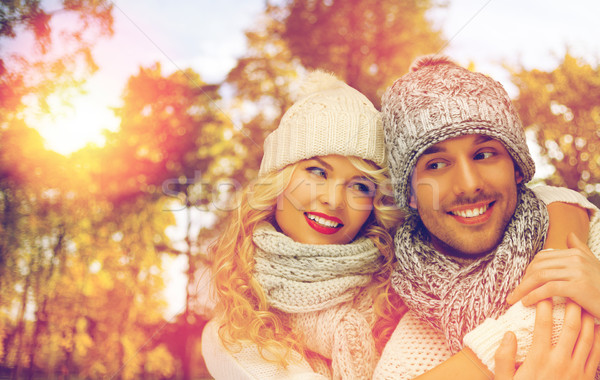 happy couple in warm clothes over autumn Stock photo © dolgachov