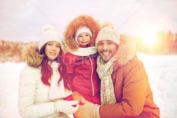 happy family with child in winter clothes outdoors Stock photo © dolgachov