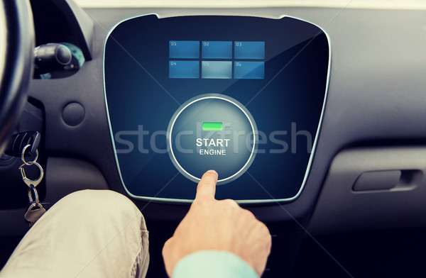 close up of man using starter application in car Stock photo © dolgachov
