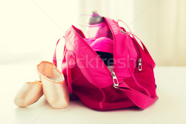 close up of pointe shoes and sports bag Stock photo © dolgachov