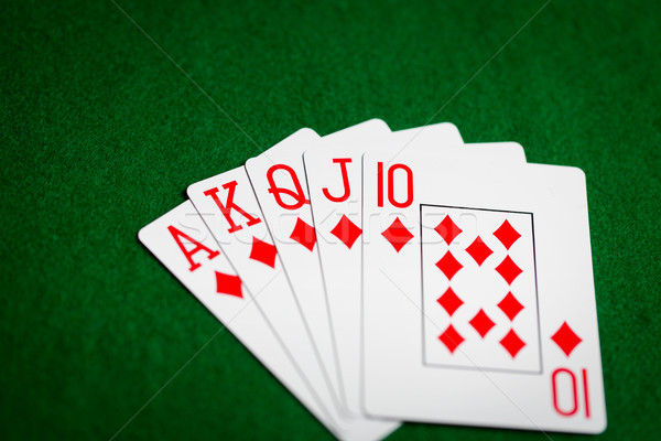 Poker hand speelkaarten groene casino doek Stockfoto © dolgachov