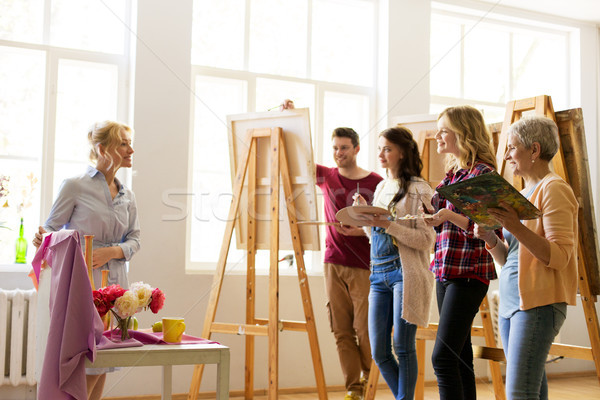 drawing teacher and students at art school Stock photo © dolgachov