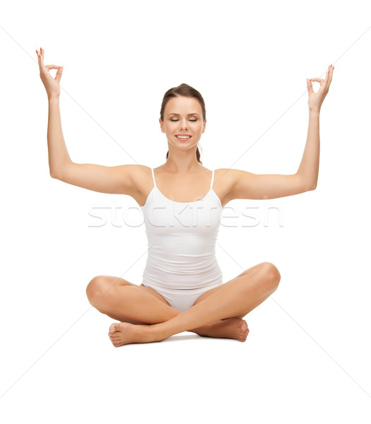 woman in cotton undrewear practicing yoga lotus pose Stock photo © dolgachov