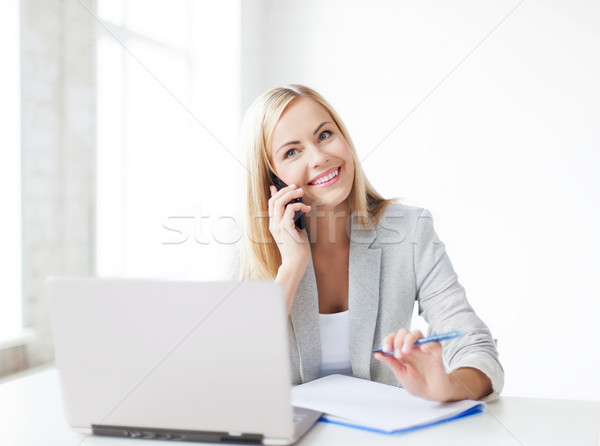 Femme d'affaires téléphone parler prendre des notes femme stylo [[stock_photo]] © dolgachov