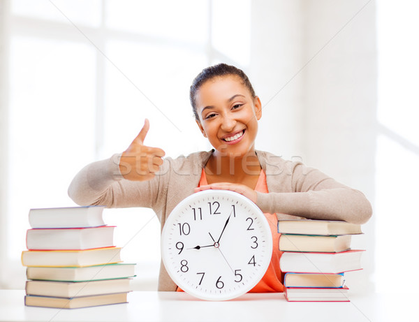 attractive woman with white clock Stock photo © dolgachov