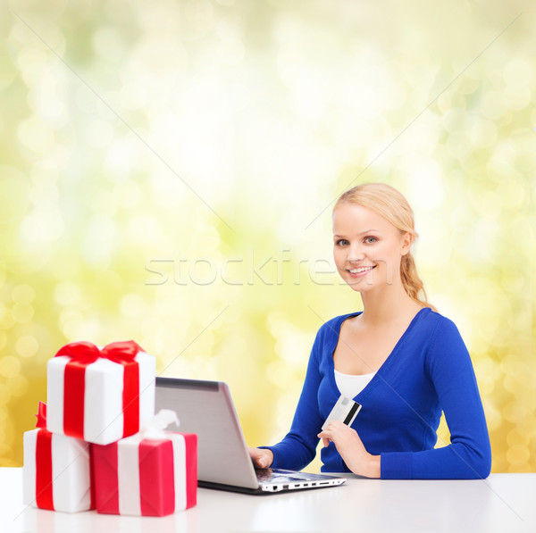 woman with gifts, laptop computer and credit card Stock photo © dolgachov