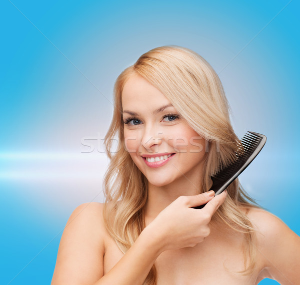 smiling woman with hair brush Stock photo © dolgachov
