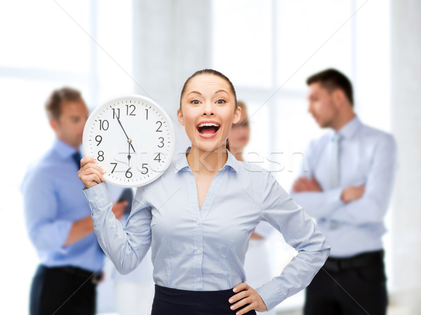 Atraente empresária parede relógio negócio tempo Foto stock © dolgachov
