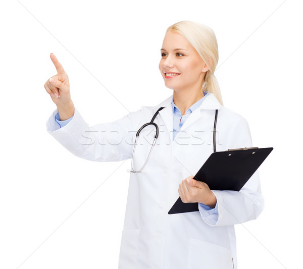 Foto stock: Sonriendo · femenino · médico · senalando · algo · salud