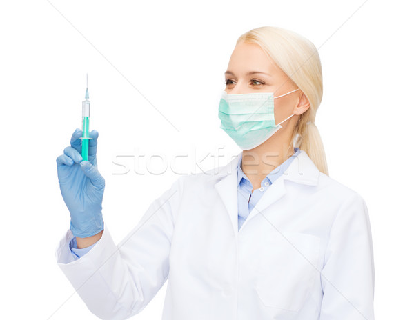 Médico máscara seringa injeção saúde Foto stock © dolgachov