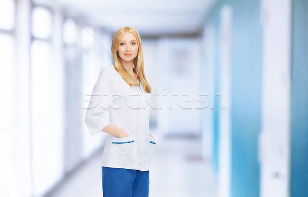 smiling female doctor or nurse in medical facility Stock photo © dolgachov