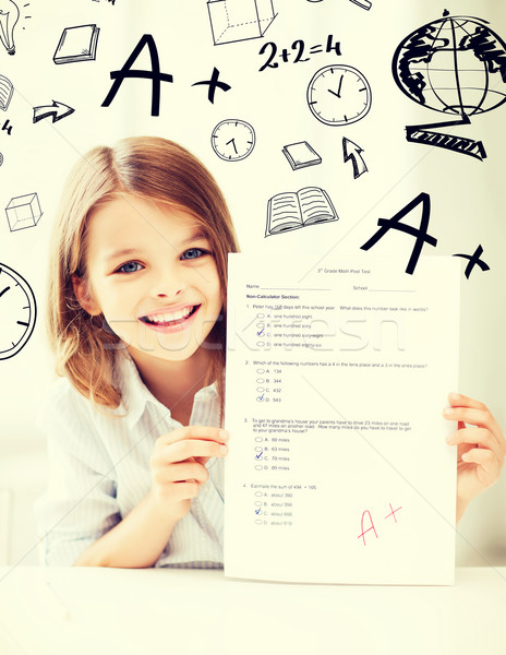 girl with test and A grade at school Stock photo © dolgachov