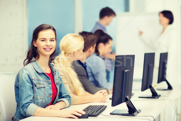 smiling teenage girl with classmates and teacher Stock photo © dolgachov
