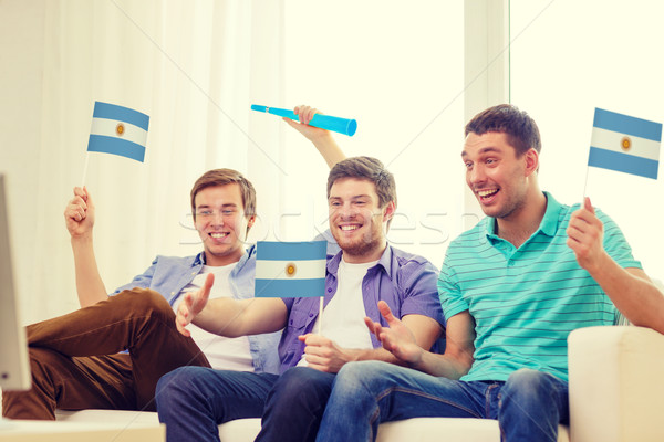Mutlu erkek arkadaşlar bayraklar dostluk spor Stok fotoğraf © dolgachov