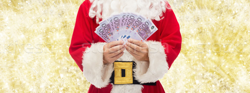 close up of santa claus with euro money Stock photo © dolgachov