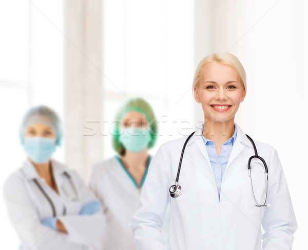smiling female doctor with stethoscope Stock photo © dolgachov