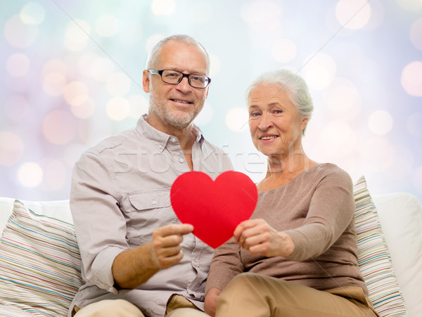 Stock photo: happy senior couple with red heart shape