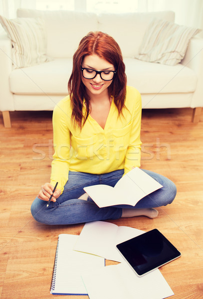 smiling teenage girl with tablet pc at home Stock photo © dolgachov