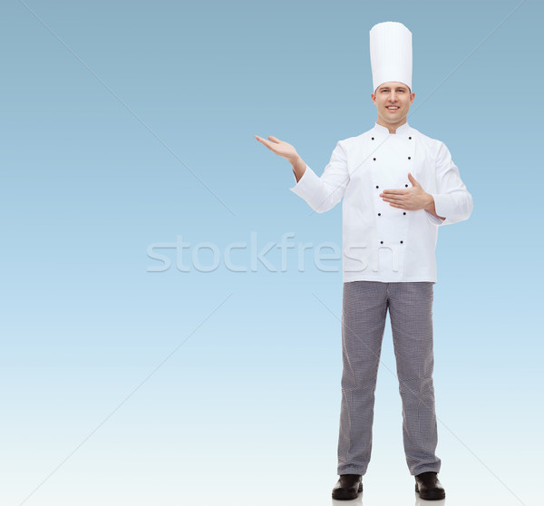 happy male chef cook inviting Stock photo © dolgachov