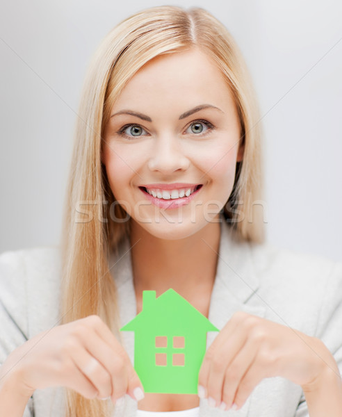 Stock photo: woman with illustration of eco house