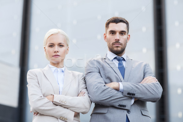 serious businessmen standing over office building Stock photo © dolgachov