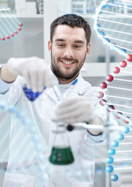 scientist with test tubes making research in lab Stock photo © dolgachov