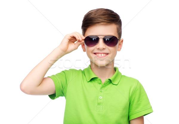 smiling boy in sunglasses and green polo t-shirt Stock photo © dolgachov
