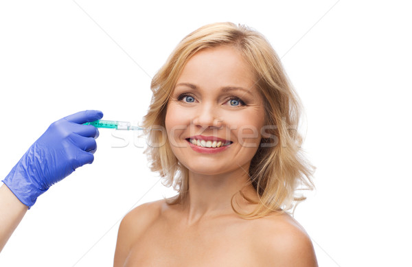 Fericit femeie fata mână seringă frumuseţe cosmetic surgery Imagine de stoc © dolgachov