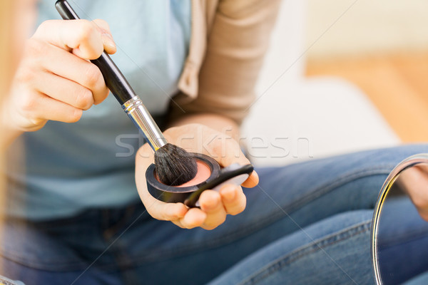 close up of woman with makeup brush and blush Stock photo © dolgachov