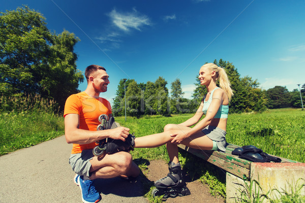 happy couple with rollerblades outdoors Stock photo © dolgachov