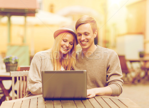 couple with laptop in cafe Stock photo © dolgachov