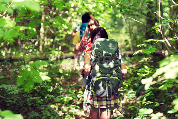 close up of friends with backpacks hiking Stock photo © dolgachov