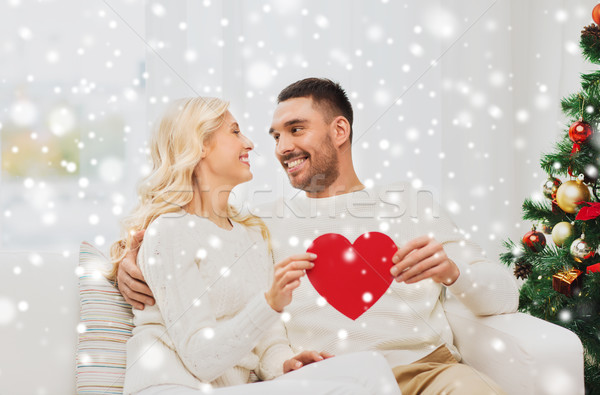 happy couple with red heart at home for christmas Stock photo © dolgachov