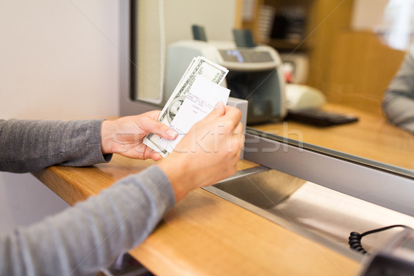customer with money and receipt at bank counter Stock photo © dolgachov