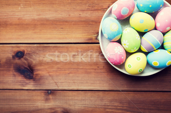 close up of colored easter eggs on plate Stock photo © dolgachov
