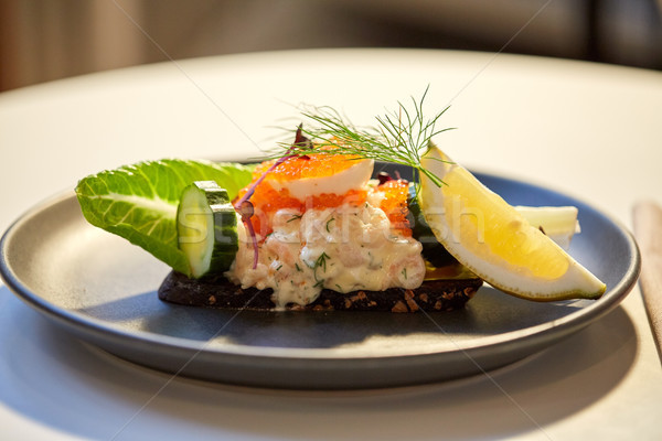 close up of toast skagen with caviar and bread Stock photo © dolgachov