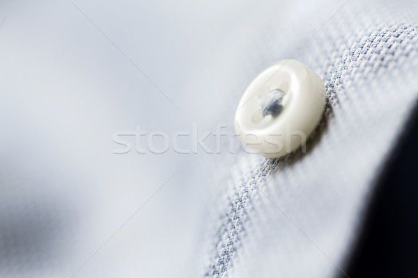 close up of blue shirt button Stock photo © dolgachov