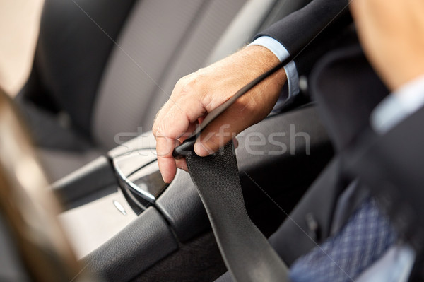 senior businessman fastening car seat belt Stock photo © dolgachov
