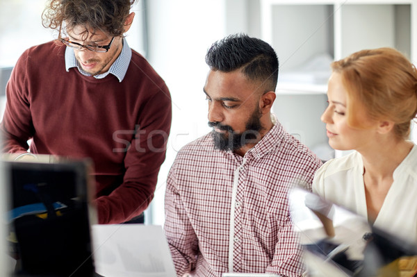 business team with papers at office Stock photo © dolgachov